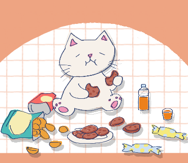 おやつを食べる猫